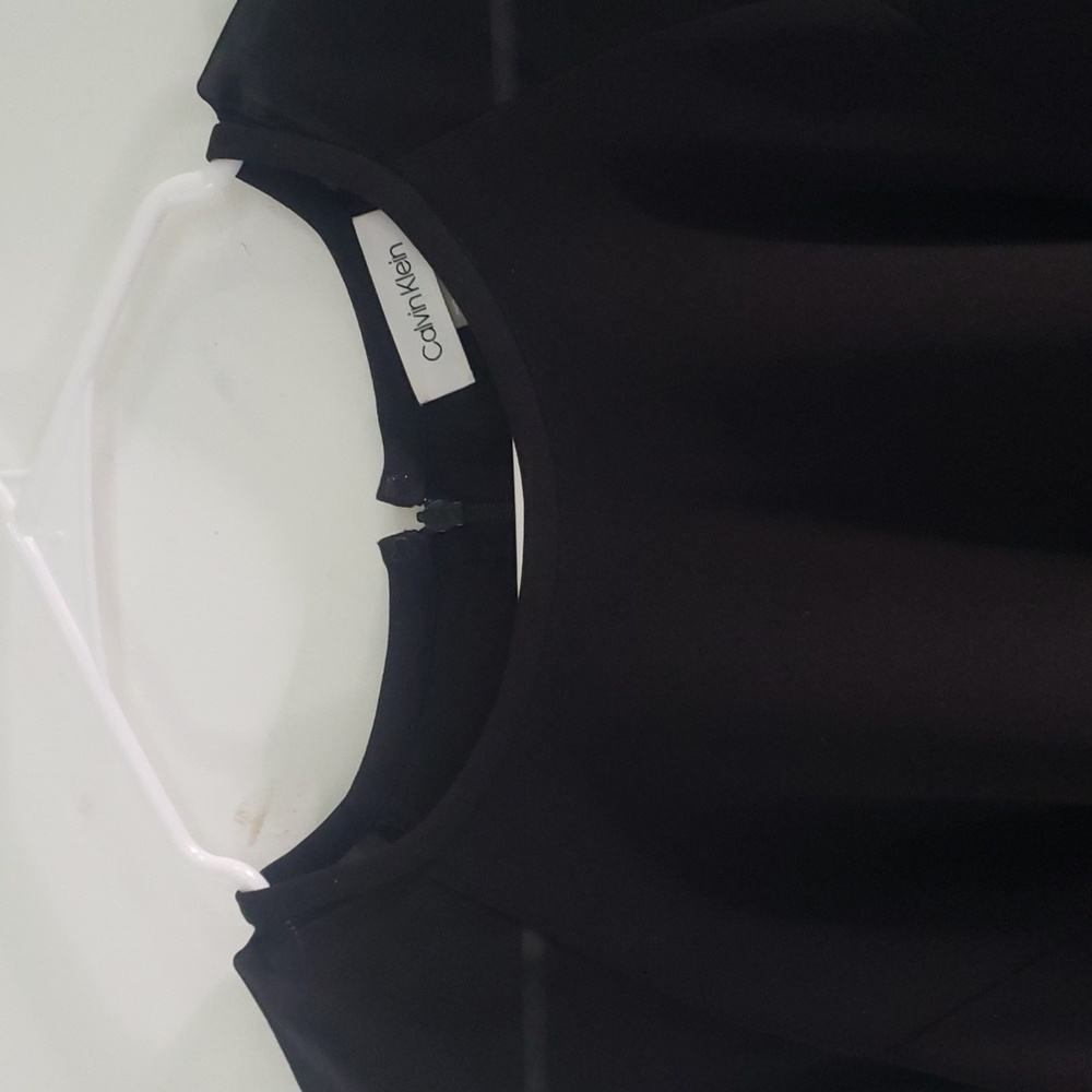Black Calvin Klein dress with long sheer sleeves